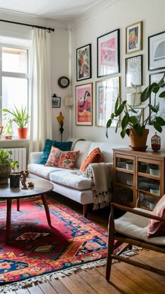 a living room filled with furniture and lots of pictures on the wall above it's windows