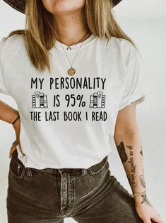 a woman wearing a t - shirt that says, my personality is 95 % the last book i read