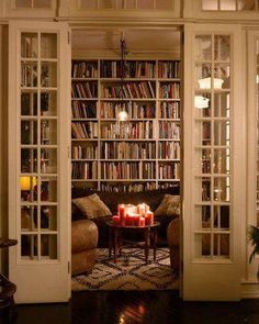 a living room filled with lots of books