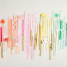 there are many different colored toothbrushes lined up