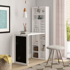 a white desk and chair in a room with a rug on the floor next to it