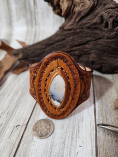 Check out this item in my Etsy shop https://www.etsy.com/listing/1390418259/dendrite-opal-tooled-leather-cuffstone Rustic Hand Tooled Leather Jewelry, Western Style Brown Cuff Bracelet As Gift, Rustic Leather Stamped Jewelry, Southwestern Hand-tooled Brown Bracelets, Southwestern Hand Tooled Brown Cuff Bracelet, Handmade Western Style Brown Cuff Bracelet, Handmade Western Brown Cuff Bracelet, Western Hand Tooled Cuff Bracelet As Gift, Artisan Stamped Brown Jewelry