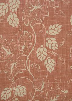 an orange fabric with white flowers on it