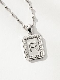 Show off your initial - or your loved one’s - for a personalized statement. Our Sur Necklace is the iconic Uncommon James initial necklace that everyone should have in their jewelry collection. Choose from silver or gold, find your letter, and then make this pendant necklace yours! Letters Available: Gold: A, D, E, H, I, J, K, L, M, N, O, R, S, T Silver: A, D, E, J, K, L, M, R, S, T For a fully personalized look, shop our Initial Jewelry. | Silver Letter Sur Pendant Necklace with Initial R | Wom Engraved Necklace For Men, N Initial, Initial R, Uncommon James, Man Gay, It Boy, Initial Jewelry, M R, Necklace For Men