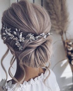 a woman wearing a hair comb with flowers in her hair