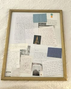 a collage of letters and pictures in a wooden frame