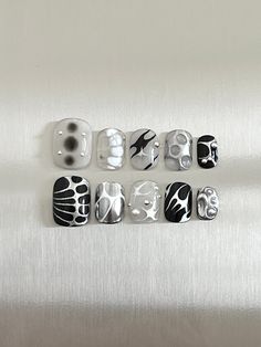 'LIMITLESS ♾️' Aura Tribal Reusable Nail Design Set All sets include 10 press on nails and come with an application kit which includes: -Nail file -Cuticle stick  -Nail glue  -Adhesive tabs -Alcohol wipes 💅🏻MODEL WEARS: Short Rounded-Square  ⚠️ IMPORTANT NOTE:  - Please measure both VERTICAL and HORIZONTAL lengths of your nail beds to ensure you order the correct size. 📏HOW TO MEASURE: 1. Place a tape horizontally across the widest points of your nail and mark both ends. 2. Remove the tape an Y2k Nail Art Short Nails, Trible Nails Designs, Black White Nails Short, Black Gray Silver Nails, Unisex Nail Art, Square Press On Nails, Metallic Nails Short, Nail Design Black And White, Chrome Short Nails Designs