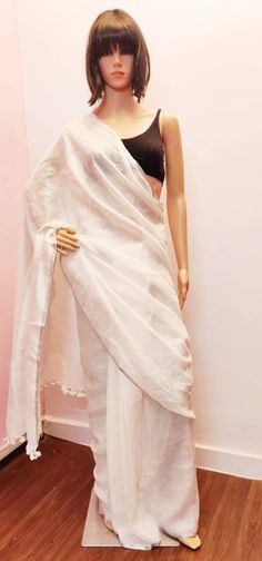 Linen sarees are always in demand.This handwoven white linen saree give you a unique style.The color is so vibrant that you are going to love it.It comes with a very narrow border,that makes it different.Linen sarees are breathable,light weight and easy to drape. Fabric: Linen by linen  Thread count:100 count Saree Color: White Occasion: Casual/Formal Saree length:5.50 mtr Blouse:80 cm Custom Stitching: Available upon request Saree Embroidery: Available upon request Blouse Stitching: Available u White Handloom Pre-draped Saree, White Cotton Silk Pre-draped Saree For Wedding, White Cotton Saree For Weddings, White Cotton Silk Pre-draped Saree With Cutdana, White Chanderi Pre-draped Saree, White Cotton Silk Pre-draped Saree, White Raw Silk Saree With Traditional Drape, White Cotton Saree With Traditional Drape, Traditional White Raw Silk Saree