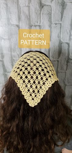 the back of a woman's head wearing a crochet hat