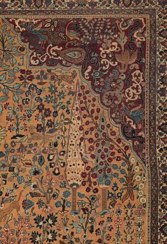 an antique persian rug with various colors and designs