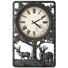 a clock that is on the side of a tree with two deer in front of it