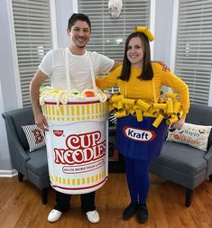 a man and woman in costumes standing next to each other with cup noodles on them