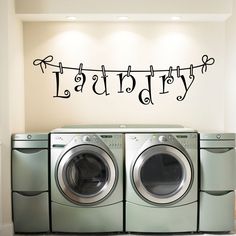 laundry decal on the wall above washer and dryer