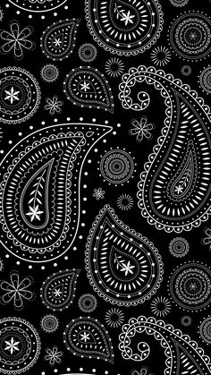 a black and white paisley pattern with lots of small dots on it's surface