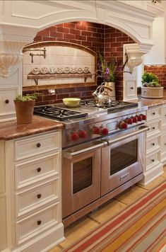 a stove top oven sitting inside of a kitchen next to a sink and counter tops