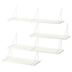 three white shelfs with one hanging off the side and two empty shelves on each side