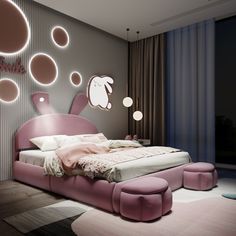 a pink bed sitting in the middle of a bedroom next to a wall with circles on it