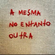 the words are written in red ink on a piece of white fabric that has been stitched onto it