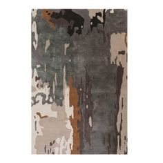 an area rug with various colors and shapes on it, including brown, gray, beige and black