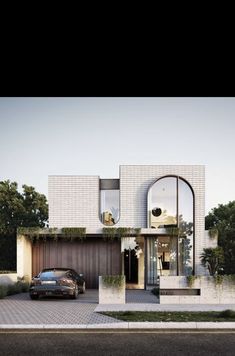 a car is parked in front of a house with large windows and arched doorways