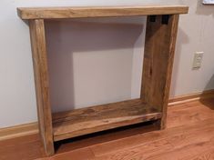 a wooden shelf sitting on top of a hard wood floor