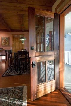 an open door leading to a deck and dining room