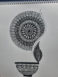 a black and white drawing of a coffee cup