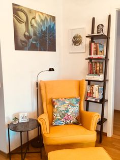 an orange chair and ottoman in a living room