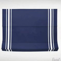 a blue and white towel hanging on the wall