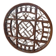 a round wooden object with intricate designs on it