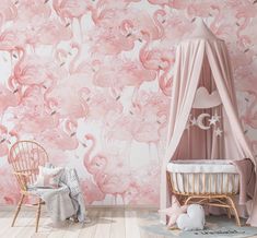 a baby's room with pink flamingos wallpaper and a white crib