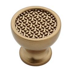 an antique brass finish cabinet knob with intricate design on the front and sides, in a square shape