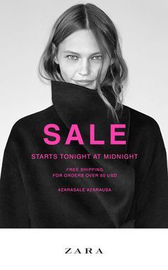 a woman with long hair wearing a black sweater and pink lettering that says sale online and in stores