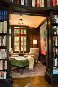 a living room filled with lots of books