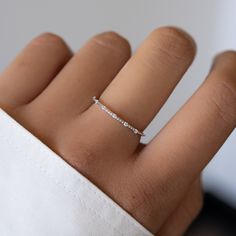 This thin, delicate and beautiful ring, featuring 7 CZ stones, is the perfect stacking ring or a minimalist ring to add to your collection! Made of 925 Sterling Silver We use a THICK, DURABLE 14k Gold or Rhodium plating - for a piece that will last you years to come! VERY HIGH QUALITY Available in sizes 4-12 Ring width: 1mm Nickel-free & Hypoallergenic We use the highest quality materials for an authentic look! Ring Sizer Rings on Model: Pave Signet Ring Rope Ring Minamalistic Rings, Silver Rings Minimalist, Elegant Silver Rings, Silver Rings Jewelry, Minimalist Rings Silver, Delicate Silver Jewelry, Silver Rings Designs For Women, Simple Rings Silver, Cute Rings Silver