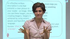 a woman standing in front of a projector screen with her hands out to the side