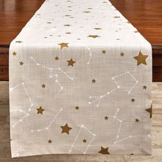 This beautiful celestial table runner provides a modern chic twist to an everyday table setting. This stellar table runner will add an out-of-this-world aesthetic appeal with its white constellation print and golden star pattern to your casual dining room area. Made of a 100% cotton material to protect your tabletop surfaces from daily wear and tear that can be used on an entryway, dining, or kitchen table for a touch of outer space charm. Constellation Decor, Casual Dining Room, Table Settings Everyday, Moon Table, Moon Baby Shower, Casual Dining Rooms, Constellation Print, Park Designs, Golden Star