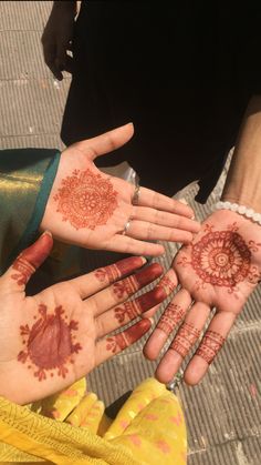 several people with their hands painted in hendi designs on the palm of their hands