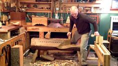 a man working in a woodworking shop