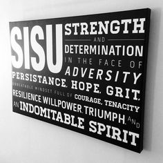 a black and white sign hanging on the wall