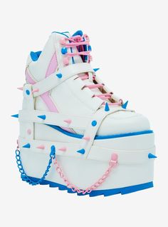 These platform sneakers are perfect for baddies who like to feel cute! They feature strappy buckles and pastel blue and pink spike detailing throughout. Plus  chain accents on the platforms.Listed in women's sizes.Heel: 4" Platform: 3''Polyurethane upper; EVA soleImported Rottmnt Oc, Alt Shoes, Goth Shoes, Painting References, White Pastel, Kawaii Shoes, Oc Ideas, Style Aesthetic, Drawing Clothes