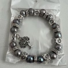 Unbranded Fashion Stretch Bracelet 9” Silver Tone Floral Beads With Gray Faux Pearls With Tree Charm New Gray Beaded Bracelet, Silver Casual Beaded Charm Bracelet, Casual Silver Beaded Charm Bracelet, Casual Silver Beaded Bracelets, Pearl Bracelet Stack, Sequin Bracelet, Handmade Bead Jewellery, Simple Bangle, Gray Bracelet