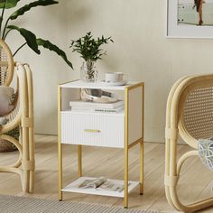 a small table with a magazine on it next to two wicker chairs and a potted plant