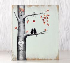 a painting of two birds sitting on a tree branch with hearts hanging from it's branches