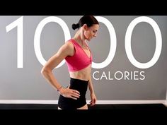 a woman standing in front of a wall with the words 100 calories written on it