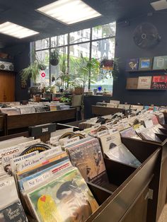 a room filled with lots of records and magazines