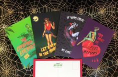 four halloween greeting cards on a table with spider webs around them and an envelope that says, let's stay in the house