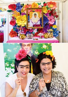 two women sitting next to each other with paper flowers on their heads