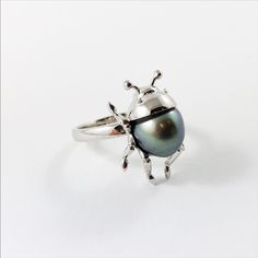 Beetle bug insect Tahitian pearl 14k white gold ring Size 6.5 US - Ready to ship or resizeThis is a baroque shaped Tahitian pearl Set in solid 14k white gold.Ring specifications:• Ring size is 6.5 US, but can be resized. Please be aware that if you choose to resize than the lead time is 2-3 weeks. Choose your size from the drop down menu.• Baroque shaped Tahitian pearl 1.08gr 10.80x8.86mm.• Solid 14k white gold.• Head including accent stones 20.09x13.40x10.17mm.• Band width approximately 2.40mm. Bug Rings, Bug Clothes, Beetle Ring, Bug Ring, Bug Jewelry, Beetle Bug, Insect Jewelry, Bugs And Insects