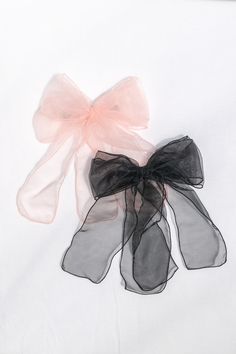 Add a touch of whimsy to your style with the Alice bow set. Featuring oversized organza bows with metal hair clips, it will hold your style in place with a cute pop of color! Available Black & Pink or Lavender & White. Please Note- This item is final sale only. . Details: Clip Length: 4" Bow Size: L 10" X W 9" Set of 2 Metal, Polyester Ribbon Imported Bows Coquette, Organza Bow, Large Hair Bows, Coquette Style, French Girl Style, Metal Hair Clips, Metal Hair, Bow Set, Metallic Hair